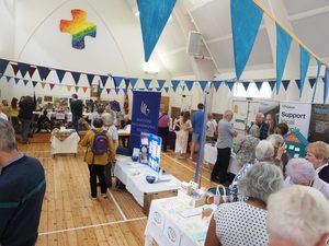 The church hall was packed with community partner stalls—New Hope, Watford Schools Trust, Watford Philharmonic Choir and more